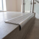 Bullnose double channel aluminium stair nosing 98x40mm fitted to a concrete step, twin Mill Aluminium inserts