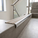 Bullnose double channel aluminium stair nosing 98x40mm fitted to a concrete step, twin Porth Stone Castellated inserts