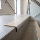 Bullnose double channel aluminium stair nosing 98x40mm fitted to a concrete step, twin Porth Stone Smooth Textured inserts