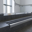 Aluminium stair nosing 90x32mm double channel fitted to a concrete step - Polished Aluminium finish with twin Black Olympic Grip inserts