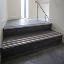 Aluminium stair nosing 90x32mm double channel fitted to a concrete step - Satin Aluminium finish with twin Peat Castellated inserts