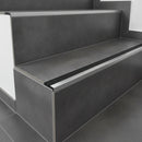 Heavy-duty aluminium stair nosing Jumbo with black PVC insert on anthracite tiled staircase UK