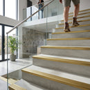Solid brass stair nosing profile 62.8mm width for heavy commercial use showing golden metallic finish