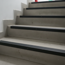 Close-up of 65mm x 42mm heavy duty aluminium stair nosing showing full-width machined ribbed tread surface