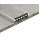Close-up cross-section of tile-in stair nosing showing flush tile installation and anti-slip insert