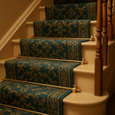 Satin brass reeded stair rods with ball finials on period British staircase with teal and gold runner