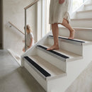 Black aluminum anti-slip stair nosing strip with textured surface for heavy duty safety applications