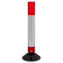 Red and white flexible traffic delineator post with reflective sleeve and black rubber base, on a white background