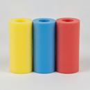 Three foam scaffold tube protector sleeves in yellow, blue and red standing upright on a plain studio background