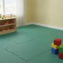 Green diamond-plate interlocking EVA foam floor tiles fitted in a children's playroom corner with a toy shelf