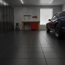 Black interlocking PVC garage floor tiles fitted in a home garage workshop with car and workbench