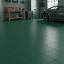 Green interlocking PVC garage floor tiles fitted in a garage with grey car and storage cabinets