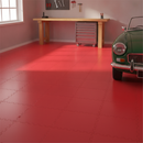 Red interlocking PVC garage floor tiles fitted in a garage workshop with classic car