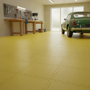 Yellow interlocking PVC garage floor tiles fitted in a workshop with classic green car