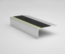 Aluminium photoluminescent anti-slip stair nosing on studio background showing carbide grit insert and glow strip