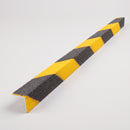 Black and yellow hazard stripe GRP stair nosing 55x55mm angle profile on a studio background