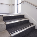 Aluminium Stair Nosing 2.75m Bullnose Single Insert 57mm in Mirrorflect Silver finish fitted on a commercial stair