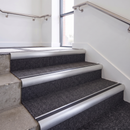 Aluminium Stair Nosing 2.75m Bullnose Single Insert 57mm in Satin Silver finish fitted on a commercial stair