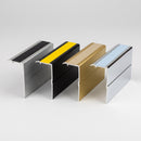 Chevron aluminium stair nosing lengths in mill, satin black, satin gold and mirrorflect silver with single inserts