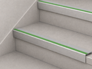 Ice grey and green slimline insert stair nosings fitted to two pale tiled steps