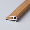 Oak wood-effect push-in laminate stair nosing profile showing the base leg, push-in channel and rounded nose
