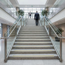DDA compliant aluminium stair nosings with yellow high visibility inserts on public building staircase UK