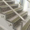 Square front aluminium stair nosings with light bronze aluminium inserts on mottled stone steps