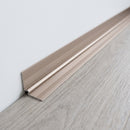 Champagne anodised aluminium internal corner trim fitted where a light grey LVT floor meets a white wall in an office reception