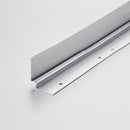 Silver anodised aluminium LVT internal corner profile 28x28mm on a plain studio background, showing the ribbed faces and countersunk fixing holes