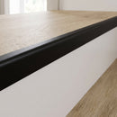 Black anodised aluminium 42x28mm stair nosing with rounded nose fitted flush on an oak click vinyl tread, 28mm face flat on the white riser