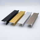 42x28mm aluminium LVT stair nosing in Black, Gold, Silver and Champagne showing the rounded bead profile