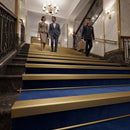 Matt brass finish self-adhesive aluminium stair nosing 30mm x 20mm fitted to a step edge