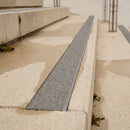 Grey 8mm non-slip stair tread insert set into a concrete step