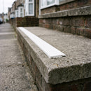 White 8mm non-slip stair tread insert set into a concrete step