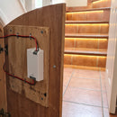 Multi-zone LED receiver mounted on a board in an under-stairs cupboard, wired to a lit tiled staircase