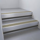 Mill Aluminium finish with Light Bronze Aluminium insert and Black Smooth Textured riser highlight - aluminium stair nosing 66x55mm fitted to a step edge