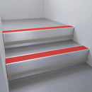 Mill Aluminium finish with Poppy Castellated insert and Black Castellated riser highlight - aluminium stair nosing 66x55mm fitted to a step edge