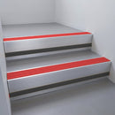 Mill Aluminium finish with Poppy Castellated insert and Black Smooth Textured riser highlight - aluminium stair nosing 66x55mm fitted to a step edge
