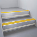 Satin Aluminium finish with Gold Castellated insert and Light Grey Castellated riser highlight - aluminium stair nosing 66x55mm fitted to a step edge