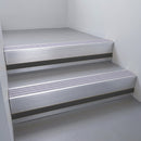 Satin Aluminium finish with Nimbus Castellated insert and Black Smooth Textured riser highlight - aluminium stair nosing 66x55mm fitted to a step edge