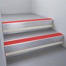 Satin Aluminium finish with Poppy Castellated insert and Light Grey Castellated riser highlight - aluminium stair nosing 66x55mm fitted to a step edge