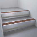 Satin Aluminium finish with Rustic Castellated insert and Black Castellated riser highlight - aluminium stair nosing 66x55mm fitted to a step edge