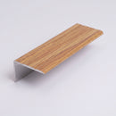 Oak effect self-adhesive aluminium stair nosing 30mm x 20mm shown alone on a plain studio background