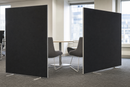 Black floor standing partition screens screening a breakout meeting area in an office