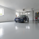 Light grey alkyd floor paint freshly applied to a UK garage concrete floor, giving a durable hard-wearing finish