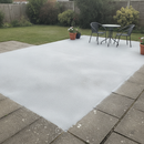 Light grey anti-slip concrete floor and patio paint freshly applied to a UK garden patio with outdoor furniture