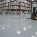 Grey glossy industrial polyurethane floor paint applied to a UK warehouse floor with a forklift truck in the background