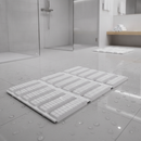 White anti-slip wet area matting laid in a bright modern hotel spa shower and changing room