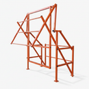 Orange powder-coated steel pivot pallet safety gate on a neutral studio background