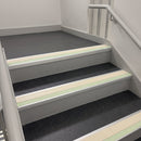 72x55mm aluminium stair nosing with a Canvas PVC insert and green photoluminescent strip fitted to college stairs